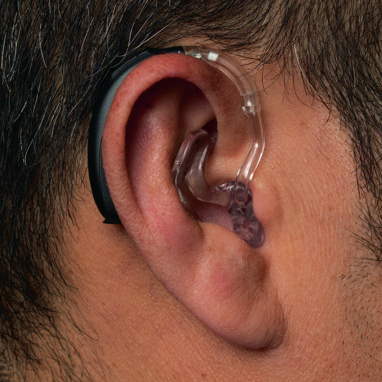 A Phonak Behind-the-Ear hearing aid with a clear tube into the canal