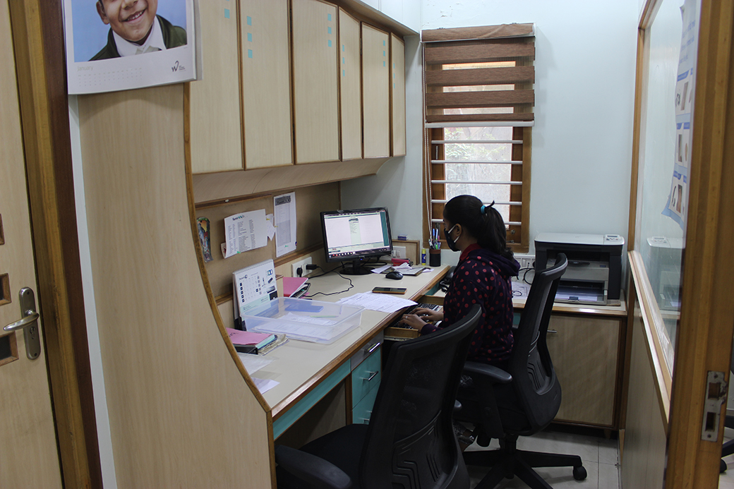 The back-office desk where records and follow-ups are kept.