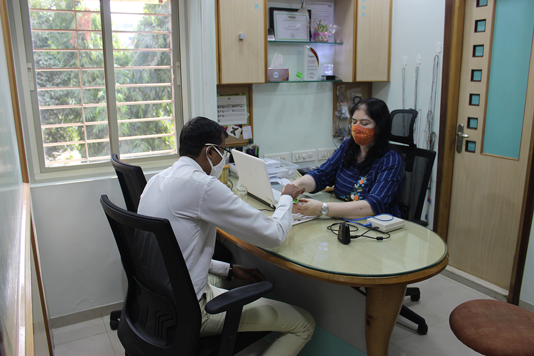 In consultation, working through a fitting with a patient.