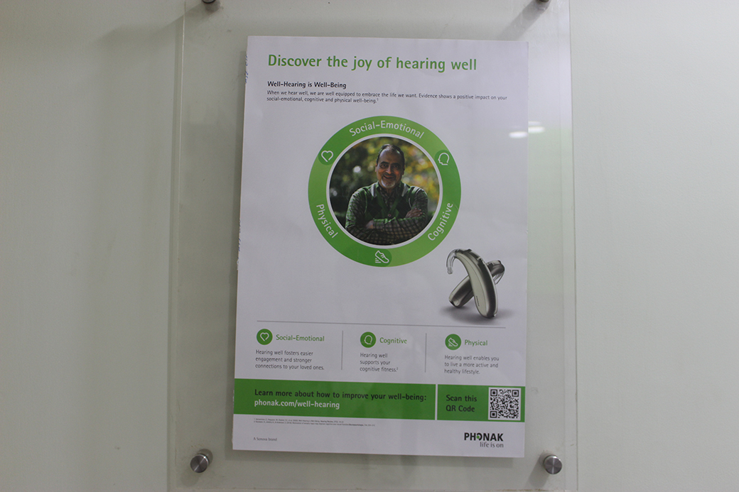 “Discover the joy of hearing well” — a Phonak campaign poster.